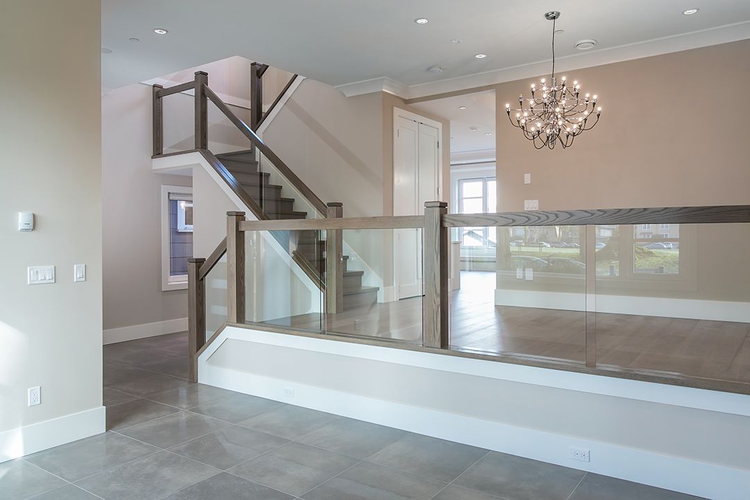 A Railing With Step Down Living Room